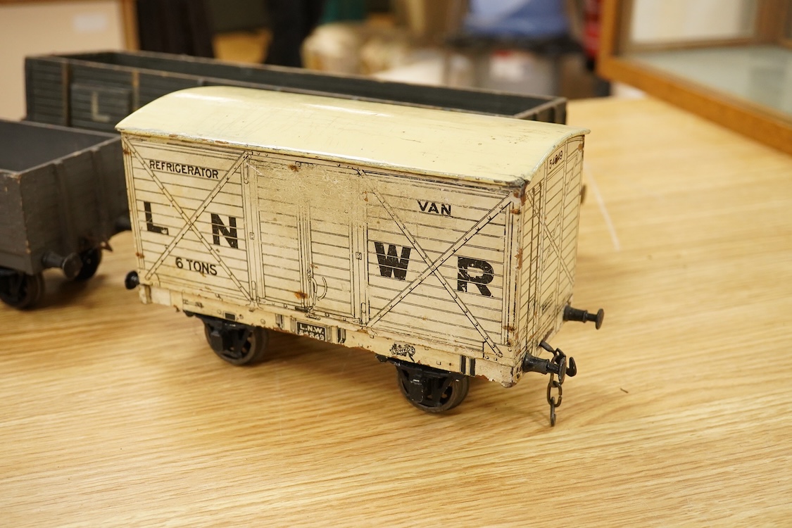 A Gauge One live steam 0-4-0T locomotive in the style of a Bowman model locomotive, with spirit fired with two simple outside oscillating cylinders, together with five LNWR and Midland Railway freight wagons, including a